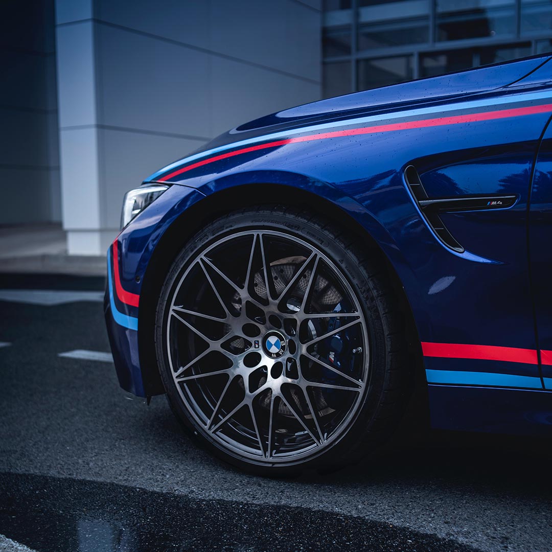 Blue BMW with red and blue pinstripes