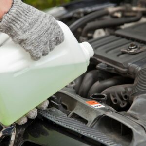 Coolant being poured into engine