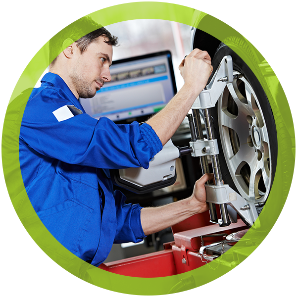 mechanic aligning tires