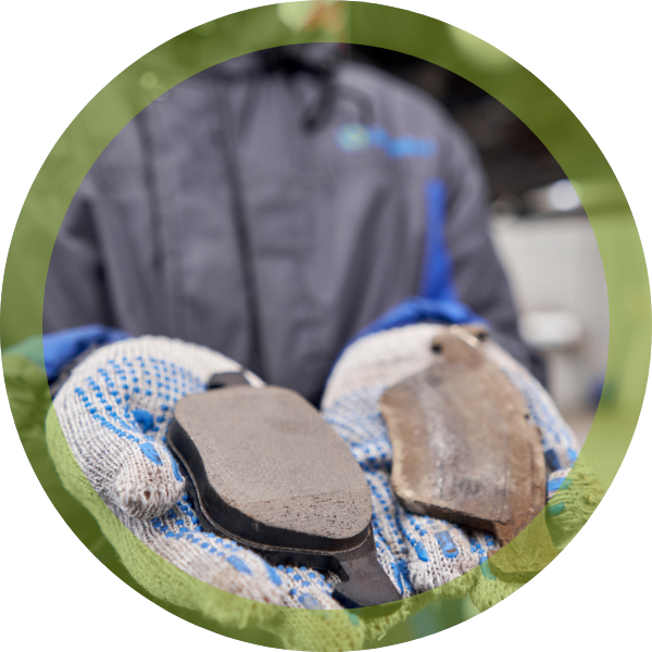 Technician holding brake pads