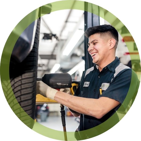 a mechanic working on a tire