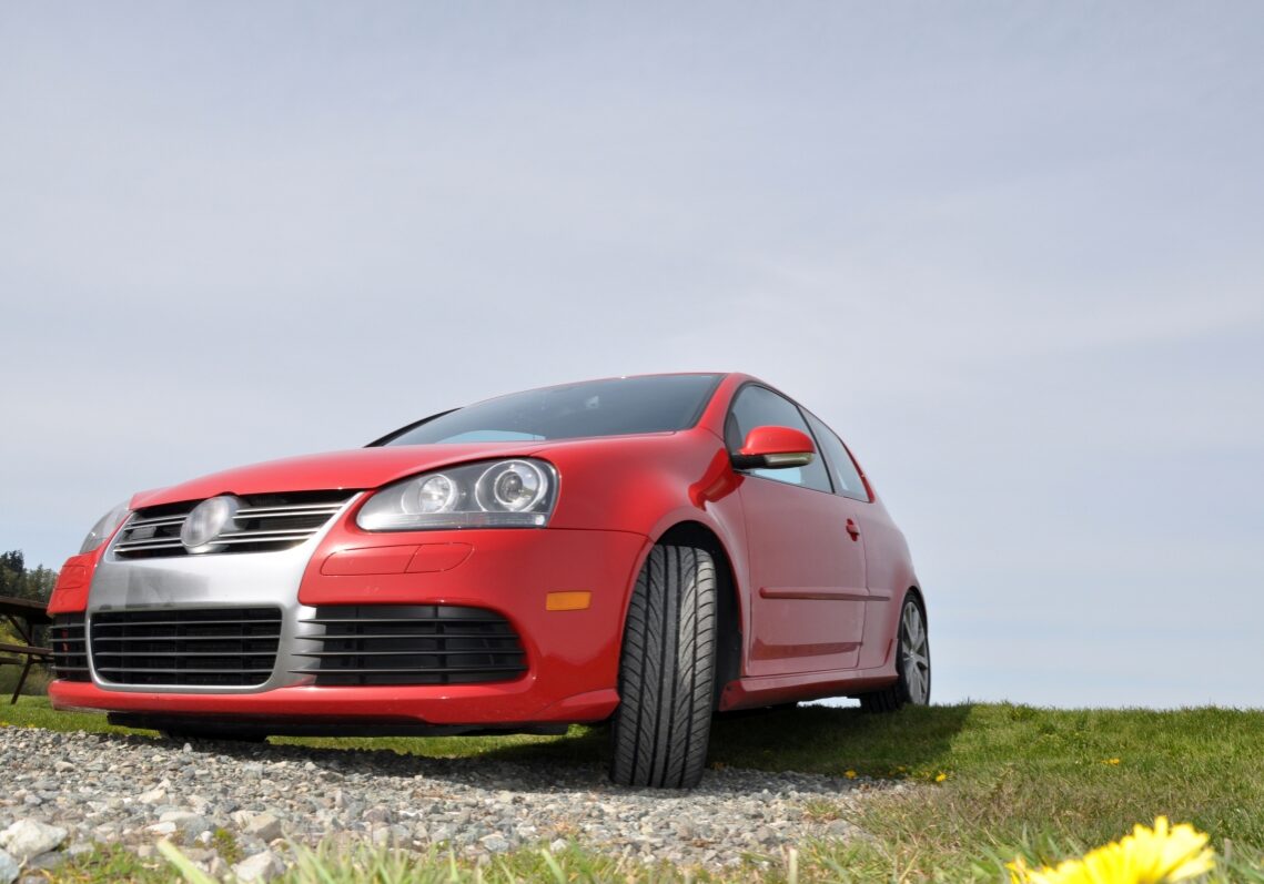 Red VW Sitting in a Field