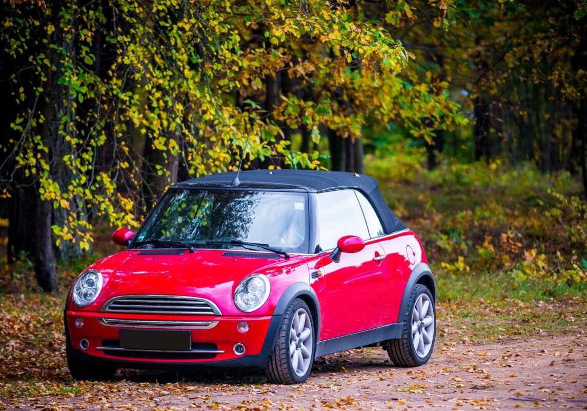 Red Mini Cooper on a Dirt Road