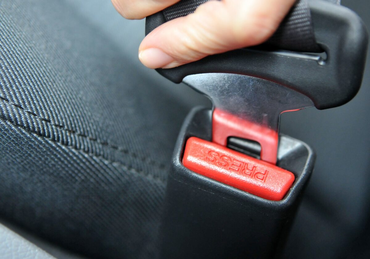 Buckling a Seatbelt Closeup